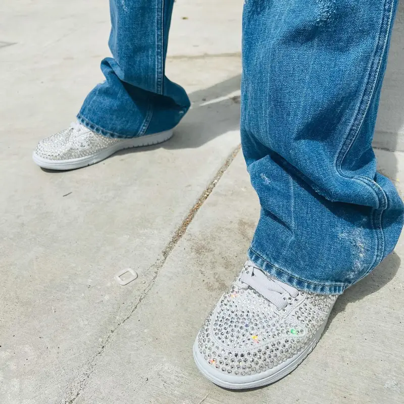 HitBoy outfit in Needles, Denim Tears, and Nike, 2022