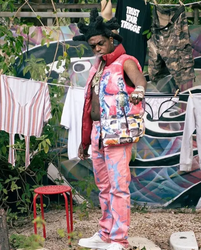 Kodak Black outfit in KidSuper, Versace, and Gucci, 2022