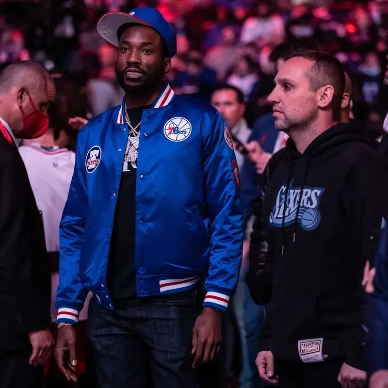 Meek Mill outfit in Dior, Nike, and Mitchell & Ness, 2022