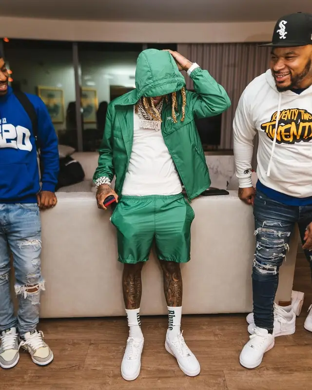 Lil Durk outfit in Prada, Nike, and Rhude, 2022