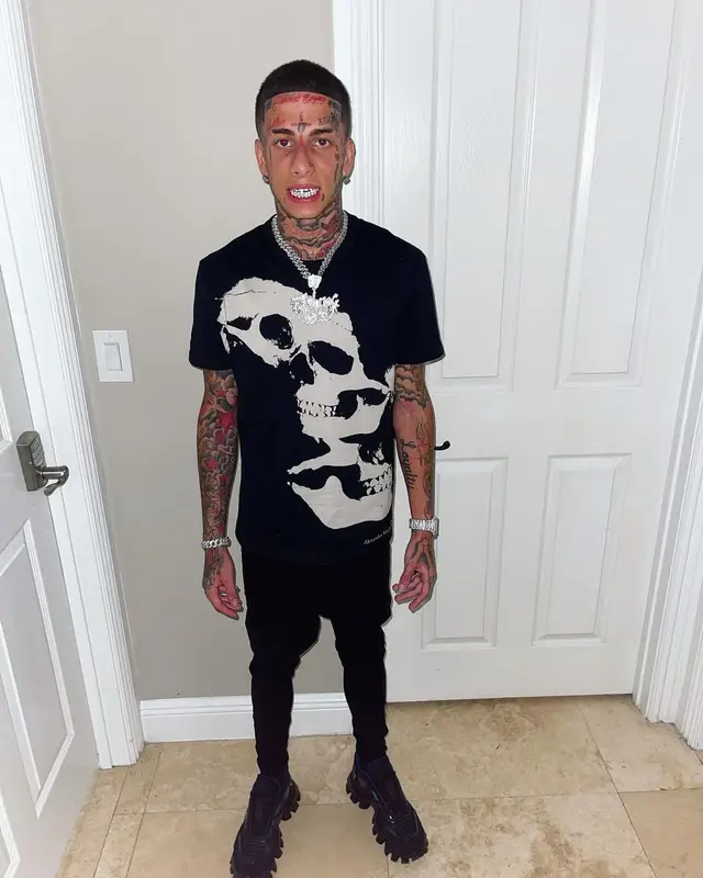 Flyysoulja outfit in Alexander McQueen, Amiri, and Prada, 2022
