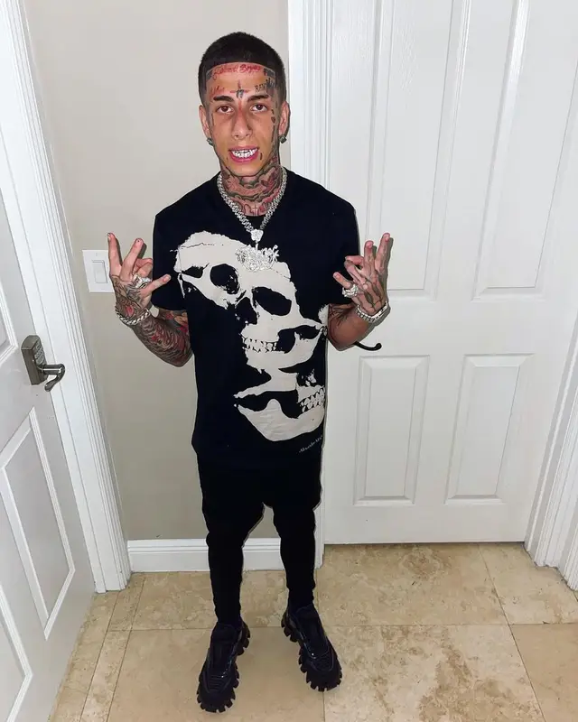 Flyysoulja outfit in Alexander McQueen, Amiri, and Prada, 2022