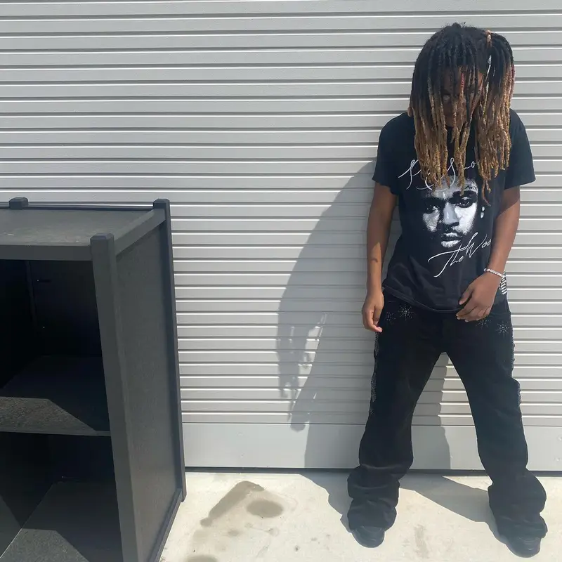 Tana outfit in Vlone, Jordan, and Pop Smoke Merch, 2022