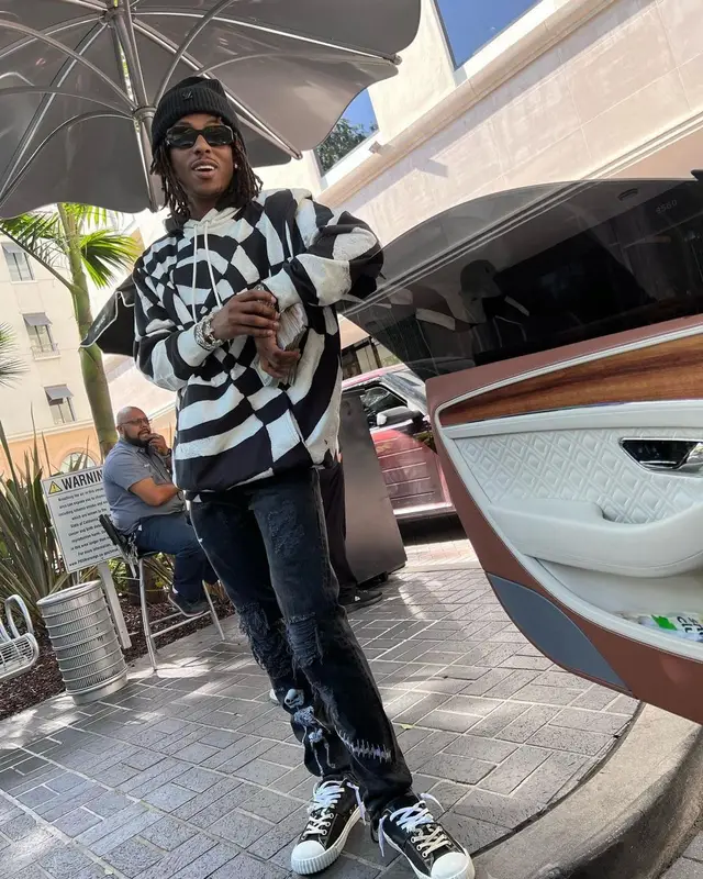 Rich The Kid outfit in Celine, Prada, and Louis Vuitton, 2022