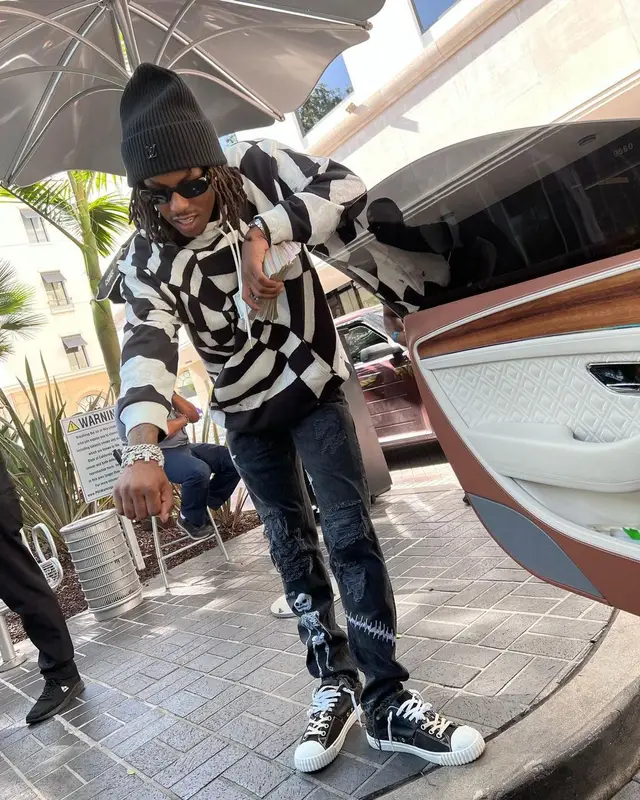 Rich The Kid outfit in Celine, Prada, and Louis Vuitton, 2022