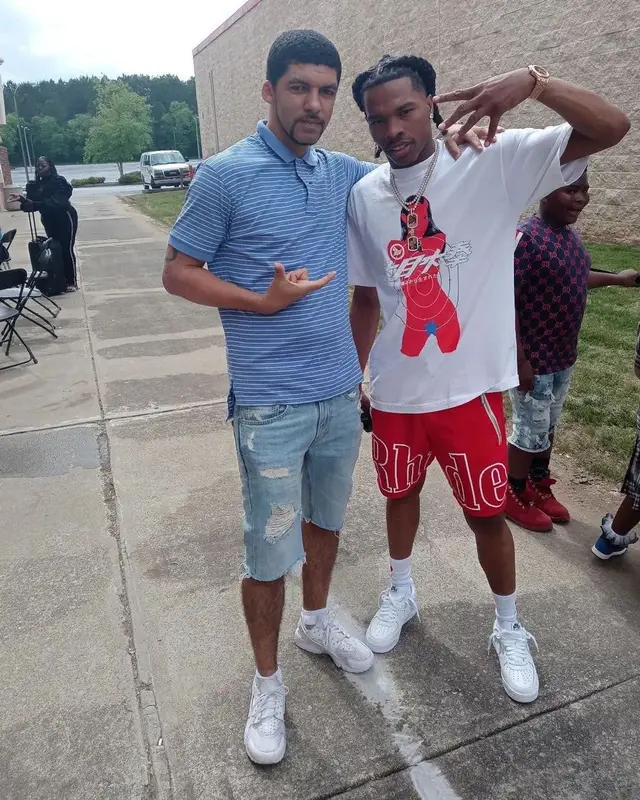 Lil Baby outfit in Sicko, Rhude, and Nike, 2022