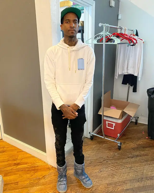 Lil Reese outfit in Amiri, Dior, and Rhude, 2022