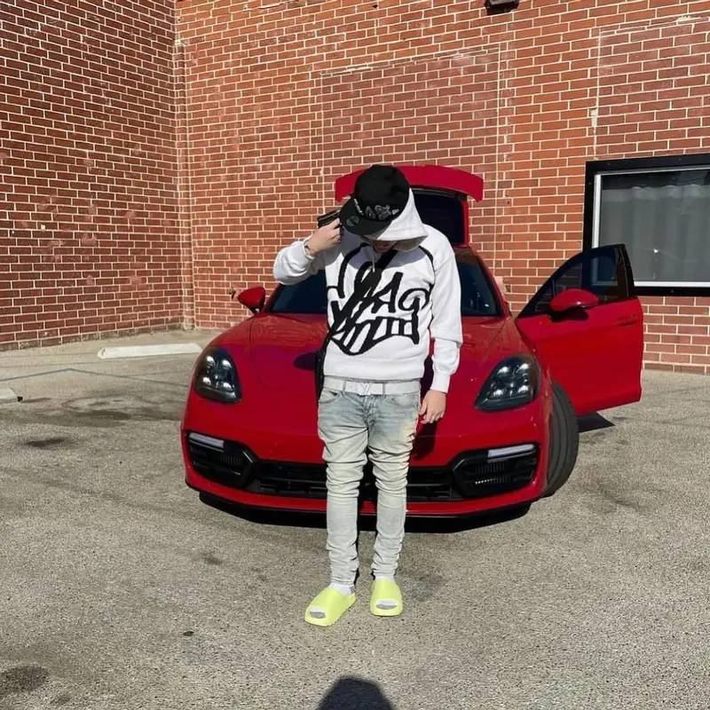 Yeat outfit in Off-White, Louis Vuitton, and New Era, 2021