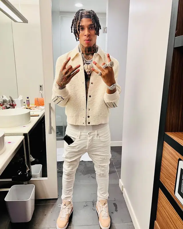 NLE Choppa outfit in Amiri, Purple Brand, and Calvin Klein, 2022