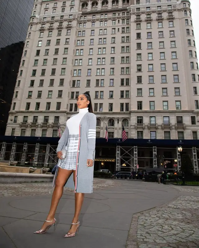 La La outfit in Thom Browne and Amina Muaddi, 2022
