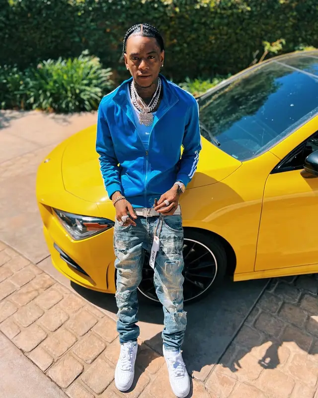 Soulja Boy outfit in Purple Brand, Nike, and Louis Vuitton, 2022
