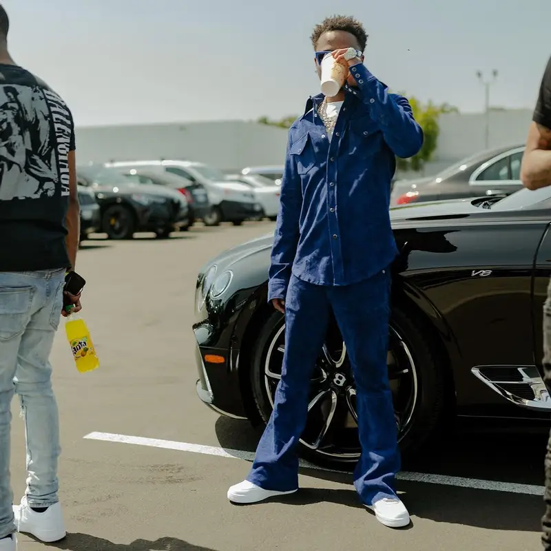 Roddy Ricch outfit in Cout De La Liberte, Nike, and Louis Vuitton, 2022