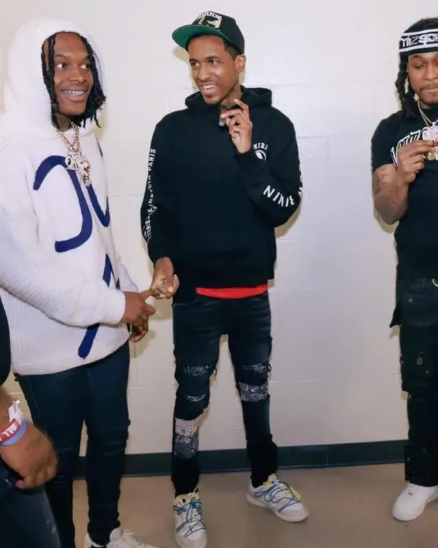 Lil Reese outfit in Amiri, Nike, and Rhude, 2022