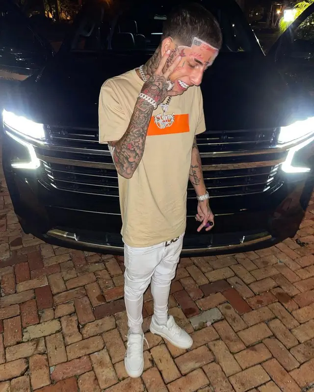 Flyysoulja outfit in Balmain, Off-White, and Dolce & Gabbana, 2022