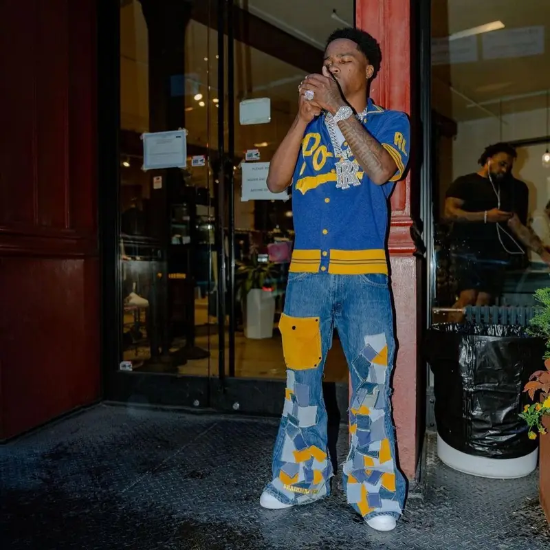 Roddy Ricch outfit in Polo Ralph Lauren, Earthling VIP, and Nike, 2022