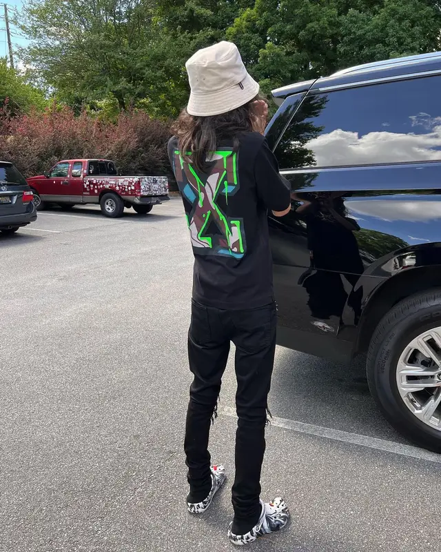 BabyTron outfit in Amiri, Cartier, and Off-White, 2022