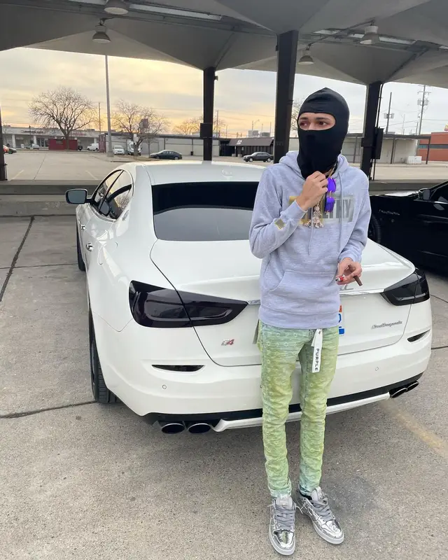BabyTron outfit in Purple Brand, Bape, and Cartier, 2022