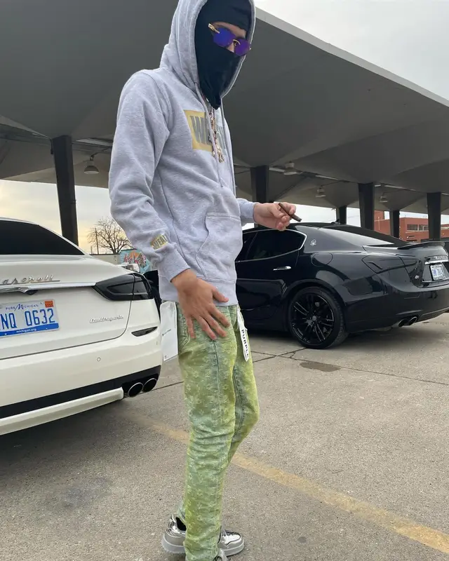 BabyTron outfit in Purple Brand, Bape, and Cartier, 2022