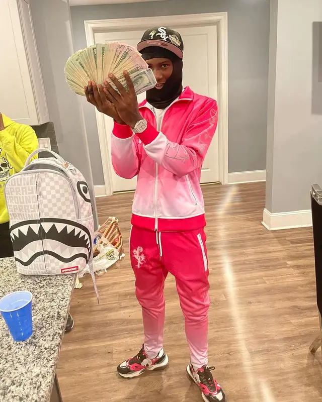 PGF Nuk outfit in Valentino, Sprayground, and New Era, 2022