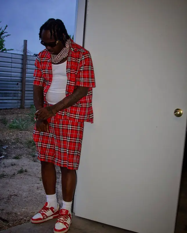 EST Gee outfit in Burberry, Louis Vuitton, and Versace, 2022