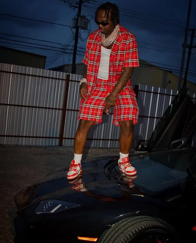 EST Gee outfit in Burberry, Louis Vuitton, and Versace, 2022