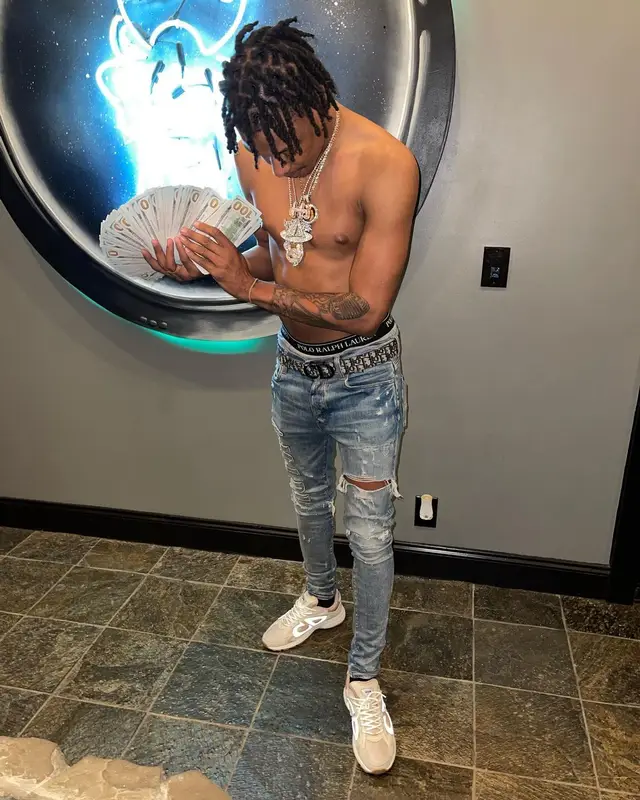 Skilla Baby outfit in Amiri, Dior, and Polo Ralph Lauren, 2022