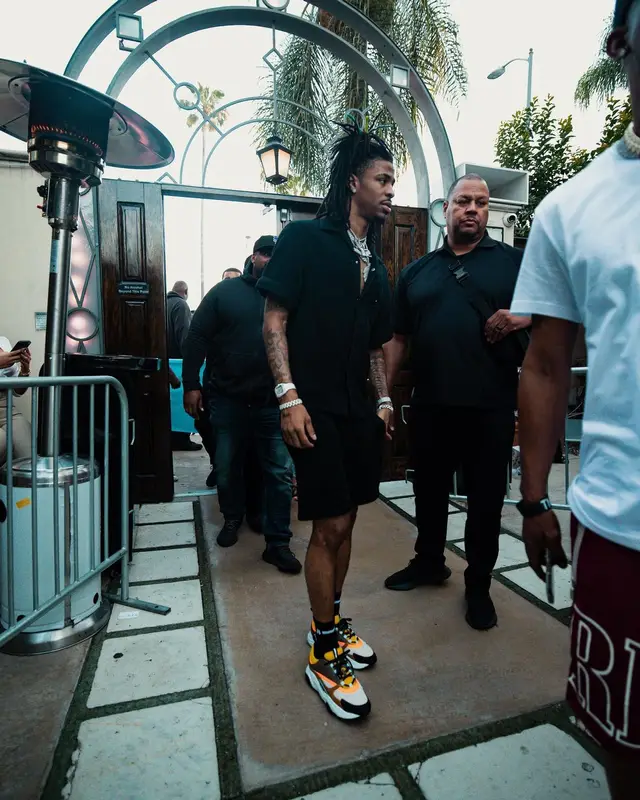 Ja Morant outfit in Prada, Dior, and Amiri, 2022