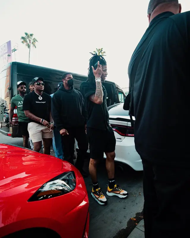 Ja Morant outfit in Prada, Dior, and Amiri, 2022