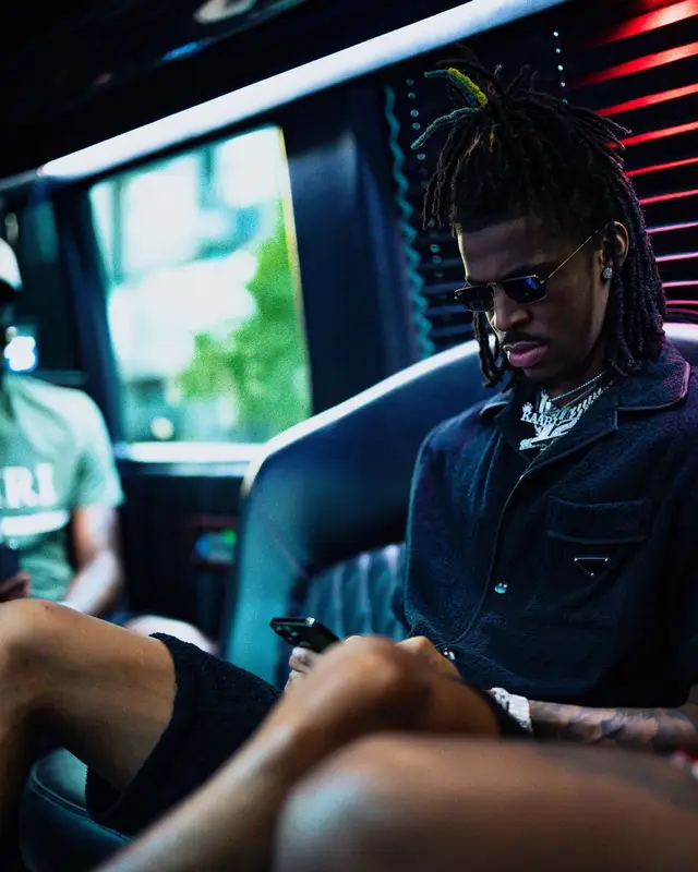 Ja Morant outfit in Prada, Dior, and Amiri, 2022