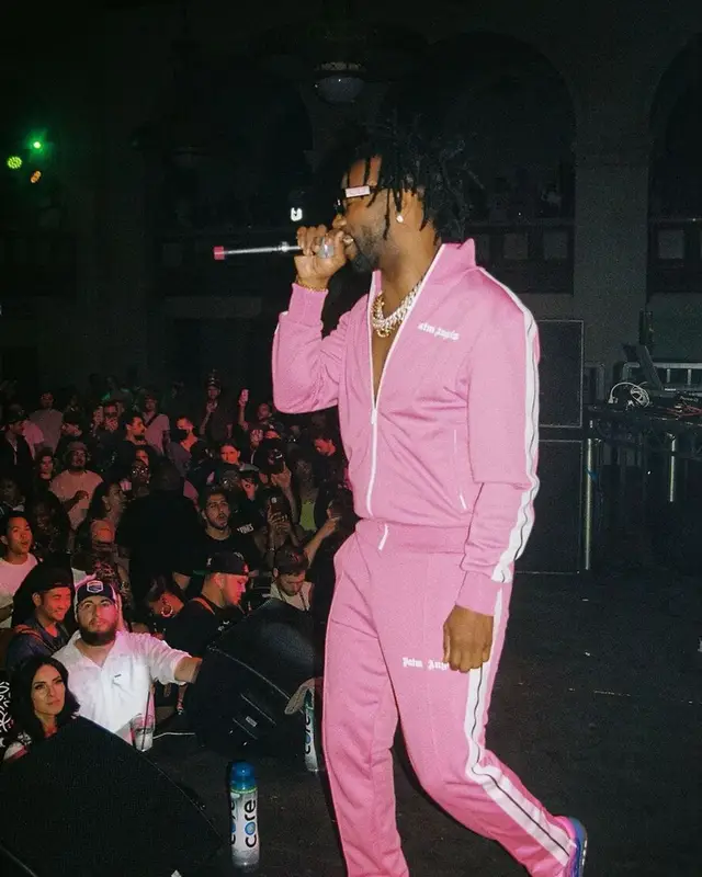 Juicy J outfit in Palm Angels, Louis Vuitton, and Dior, 2022