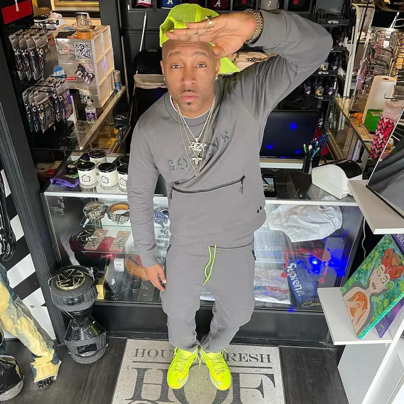Drumma Boy outfit in Nike, Richking, and LeBron James Merch, 2022