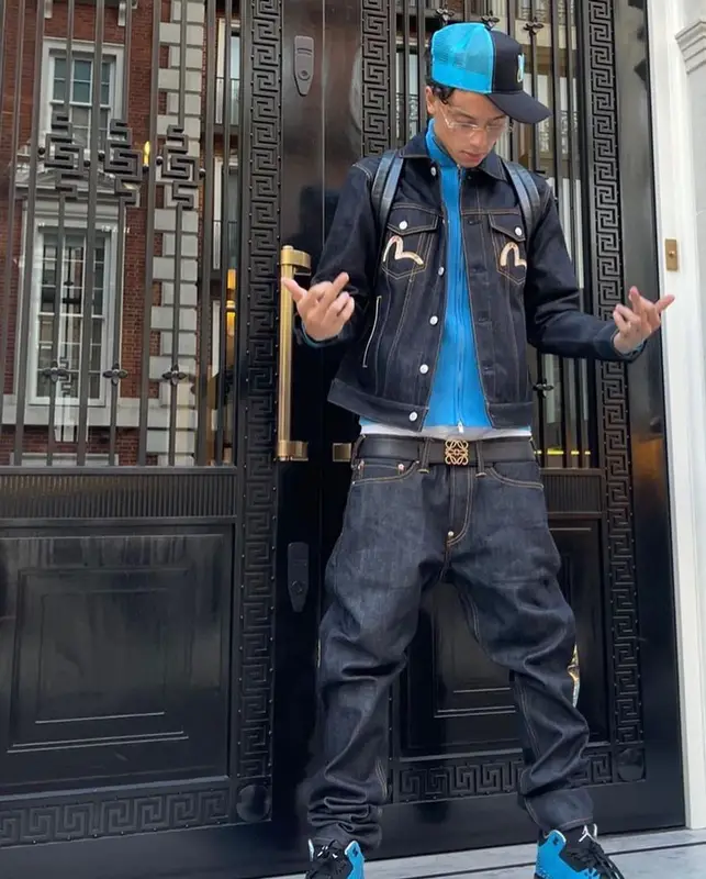 Central Cee outfit in Evisu, Louis Vuitton, and Cartier, 2022