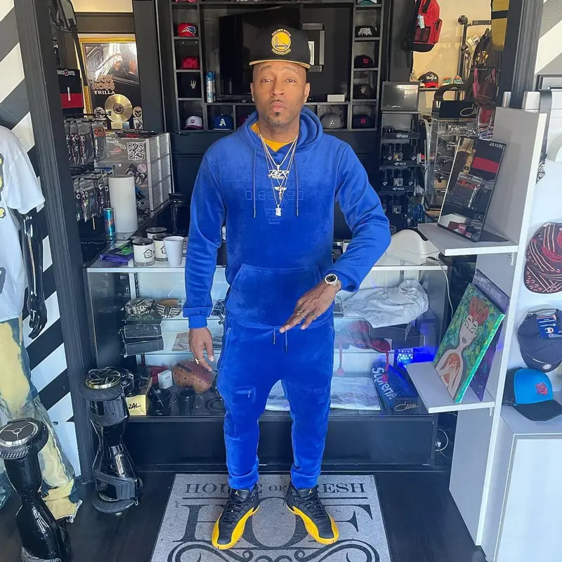 Drumma Boy outfit in The Hideout Clothing, New Era, and Jordan, 2022
