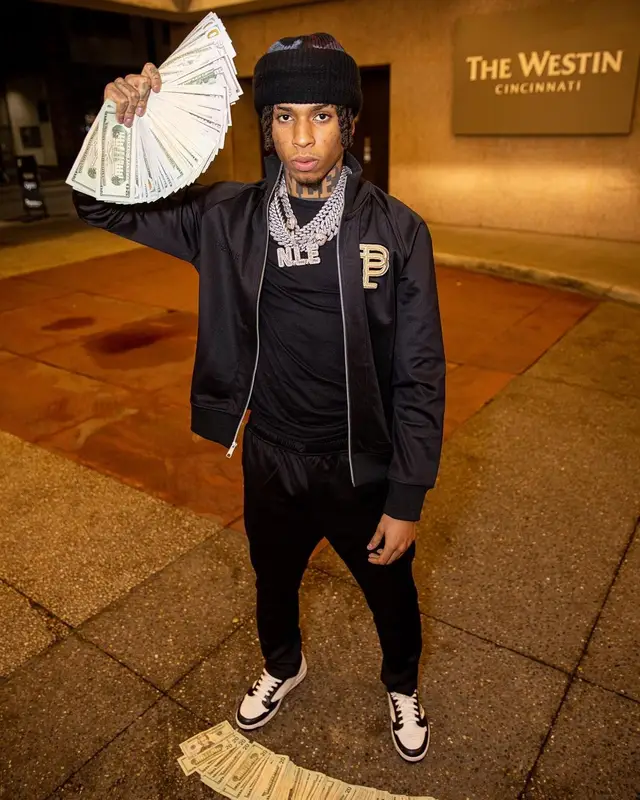 NLE Choppa outfit in Purple Brand, Prada, and De Chief , 2022