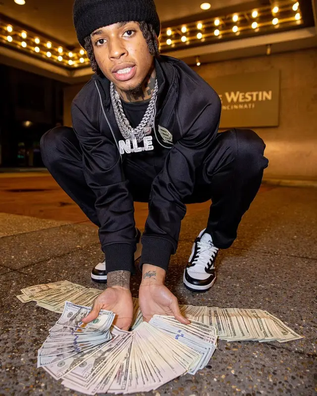 NLE Choppa outfit in Purple Brand, Prada, and De Chief , 2022
