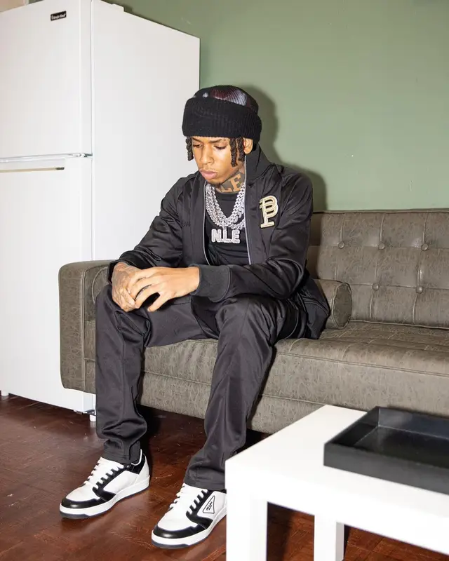 NLE Choppa outfit in Purple Brand, Prada, and De Chief , 2022