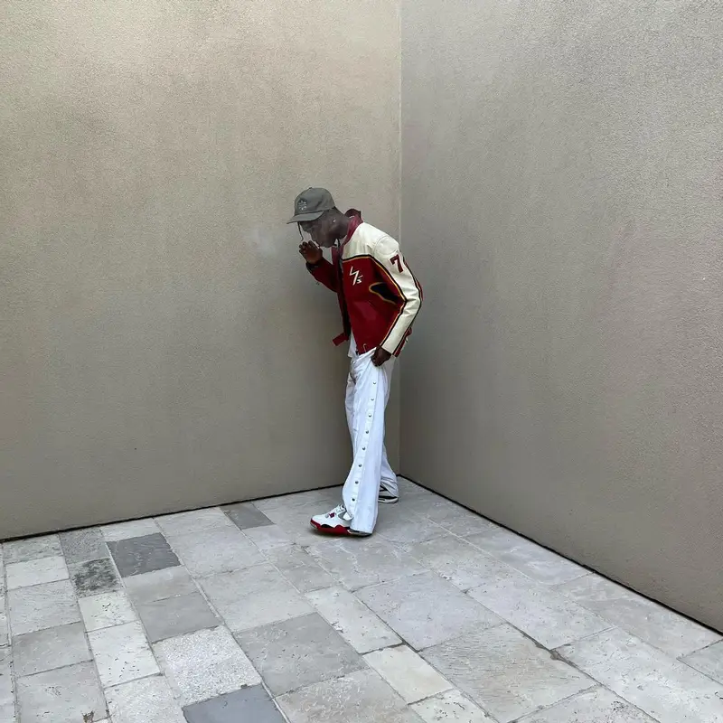 Travis Scott outfit in Yohji Yamamoto, Space Village, and Dainese, 2022