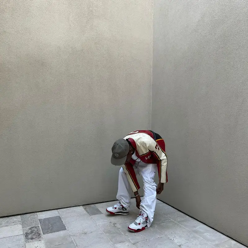 Travis Scott outfit in Yohji Yamamoto, Space Village, and Dainese, 2022
