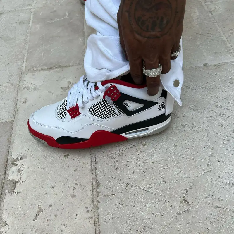 Travis Scott outfit in Yohji Yamamoto, Space Village, and Dainese, 2022