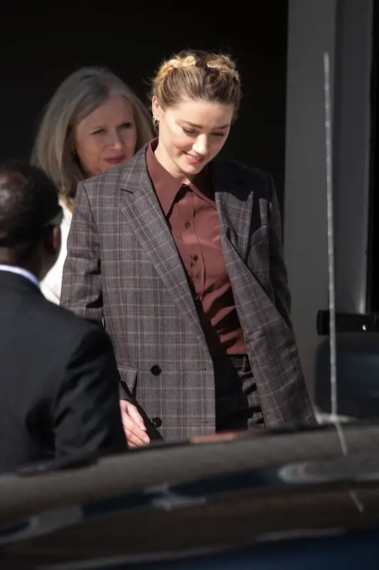 Amber Heard outfit in Brioni, Saint Laurent, and Anita Ko, 2022