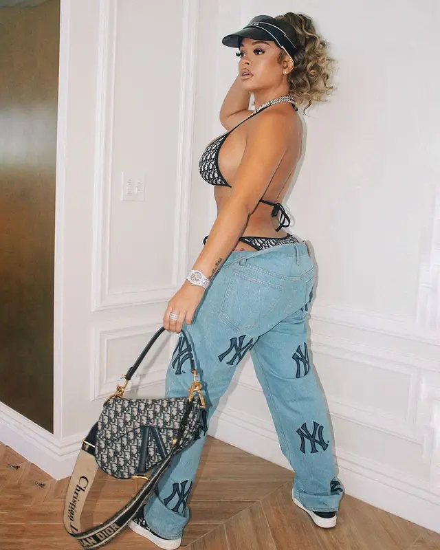 Latto outfit in Supreme, Dior, and New York Yankees, 2022