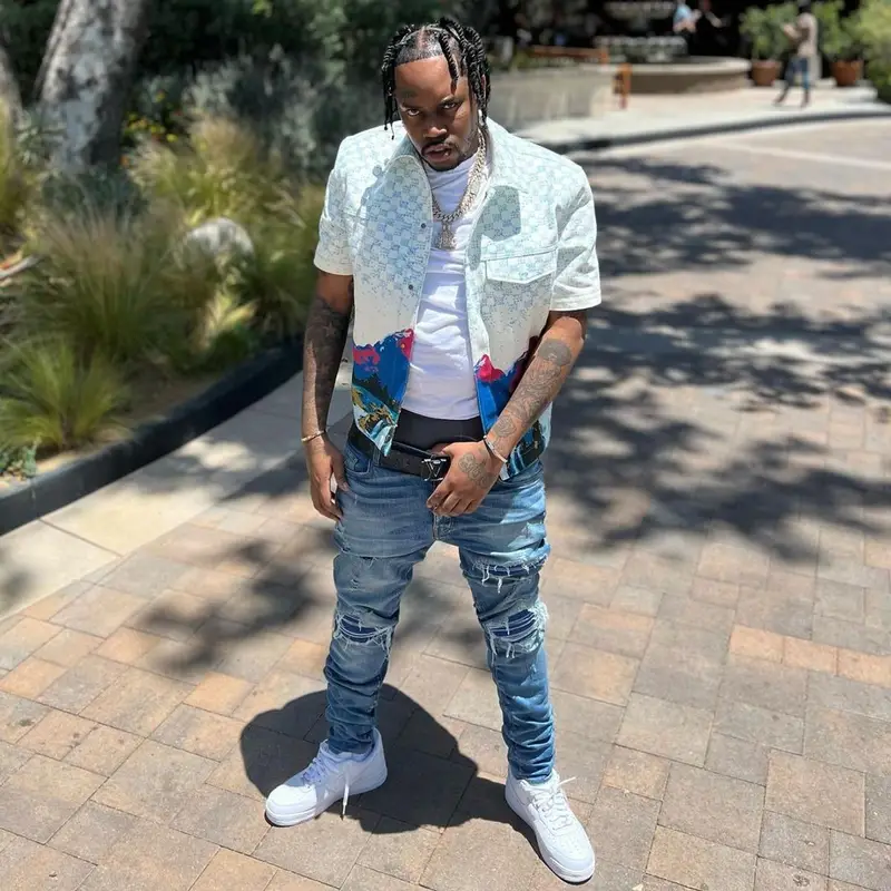 Fivio Foreign outfit in Louis Vuitton, Amiri, and Nike, 2022