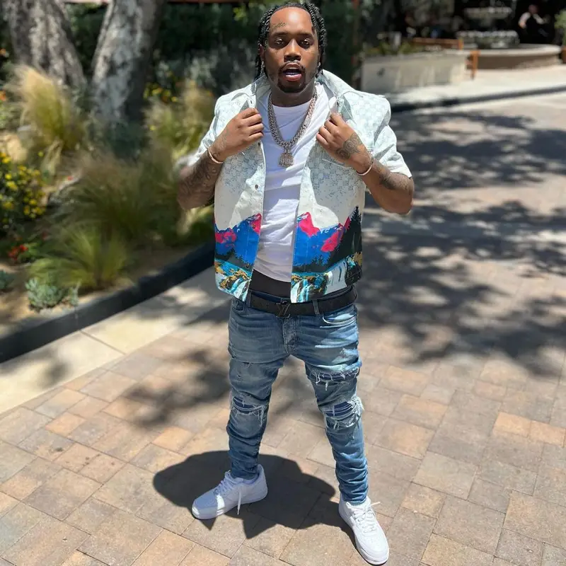 Fivio Foreign outfit in Louis Vuitton, Amiri, and Nike, 2022