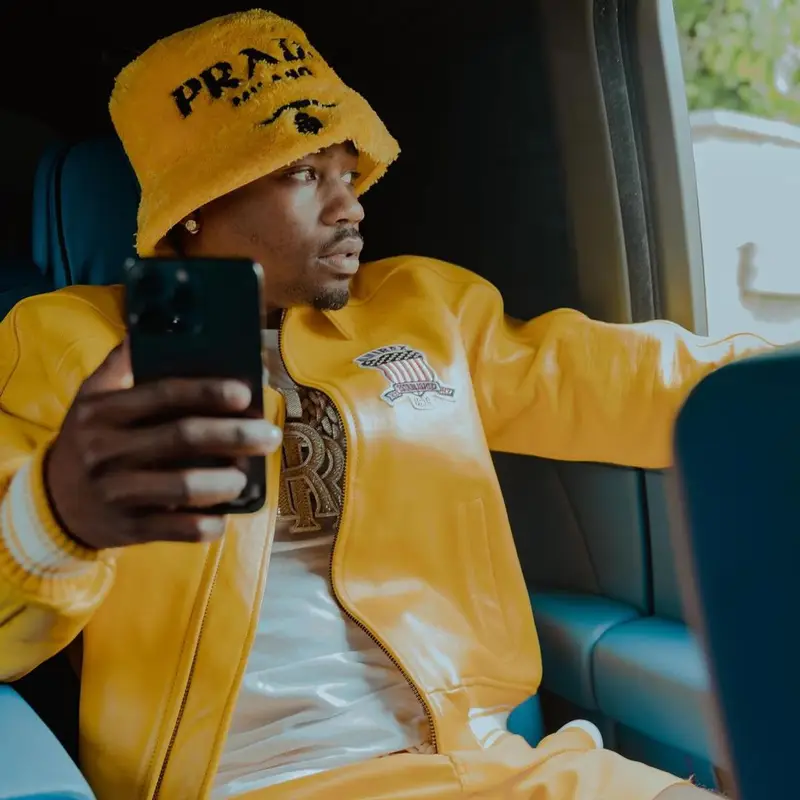Roddy Ricch outfit in Avirex, Prada, and Palm Angels, 2022