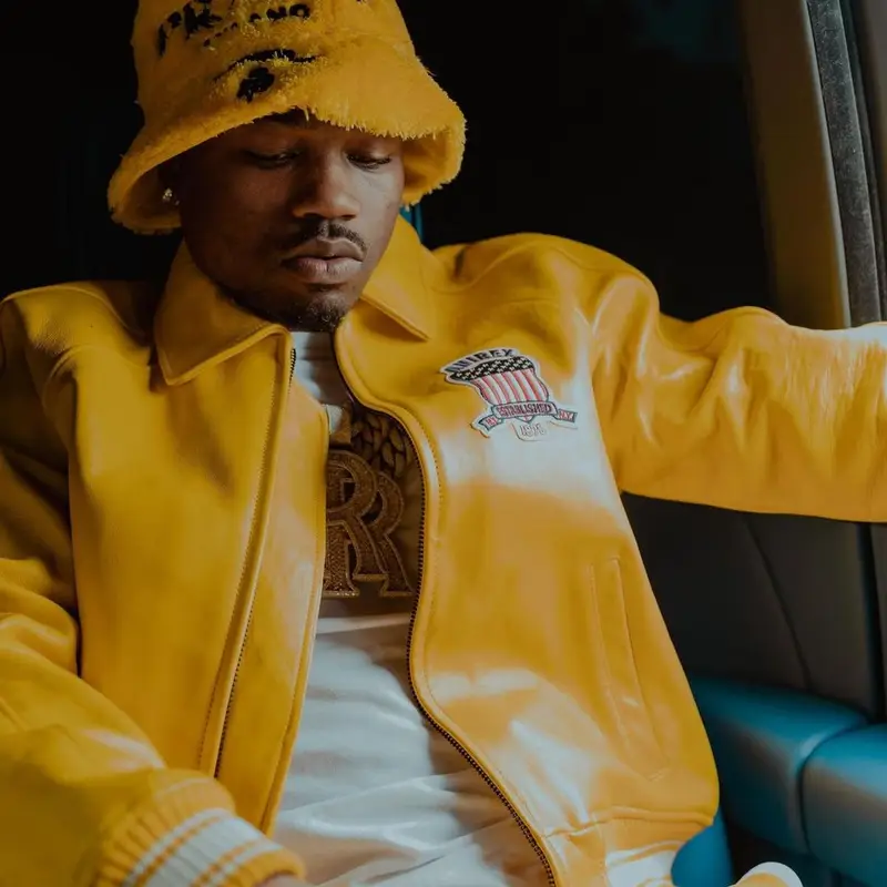 Roddy Ricch outfit in Avirex, Prada, and Palm Angels, 2022