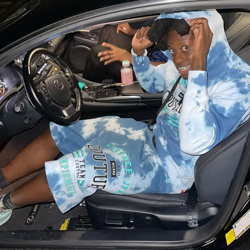 Trapland Pat outfit in Versace and Nike, 2022