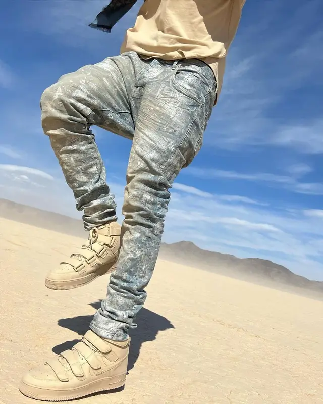 Lil Nas X outfit in Nike, Purple Brand, and Billie Eilish Merch, 2022