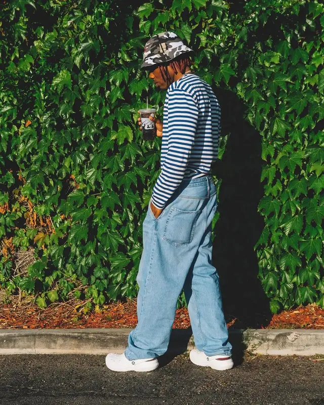 CKay outfit in Comme Des Garcons, RAW Rolling Papers, and Crocs, 2022