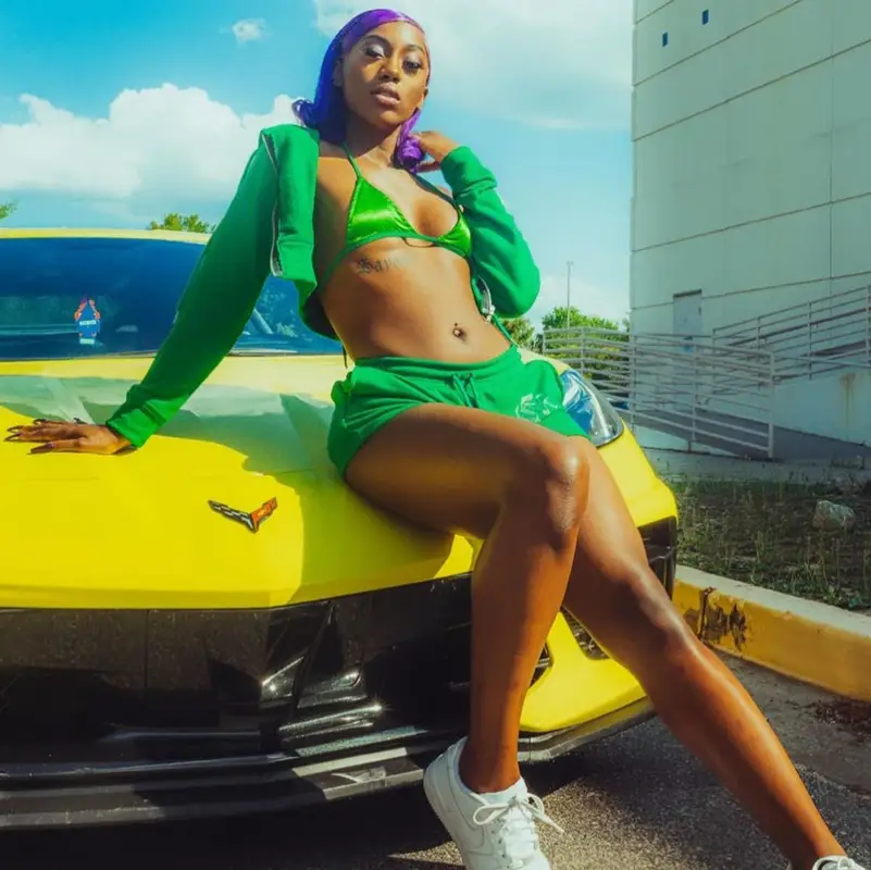 Flo Milli outfit in Chemical X Boutique and Nike, 2022