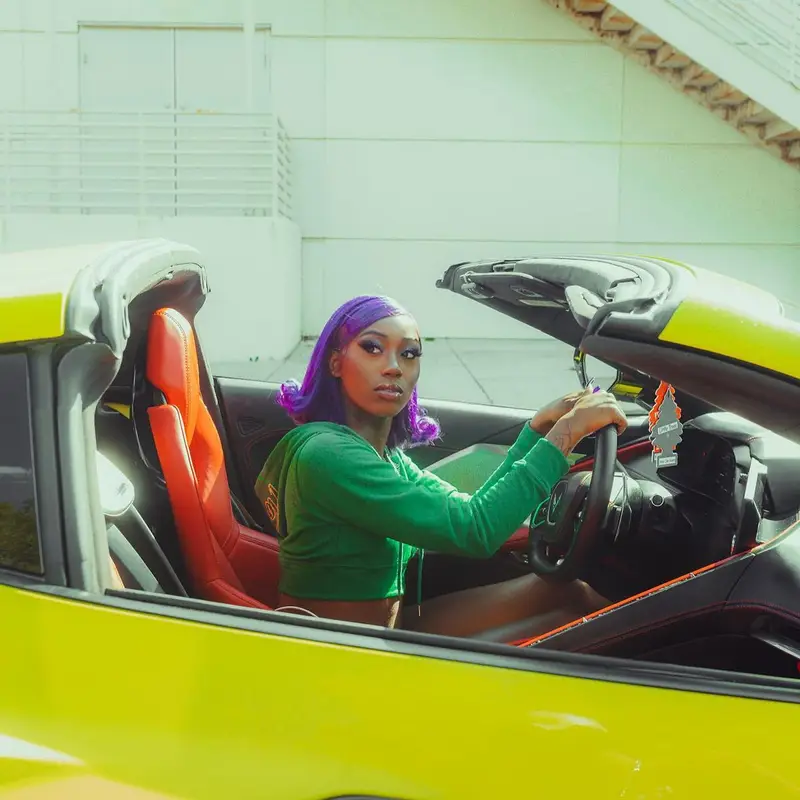 Flo Milli outfit in Chemical X Boutique and Nike, 2022